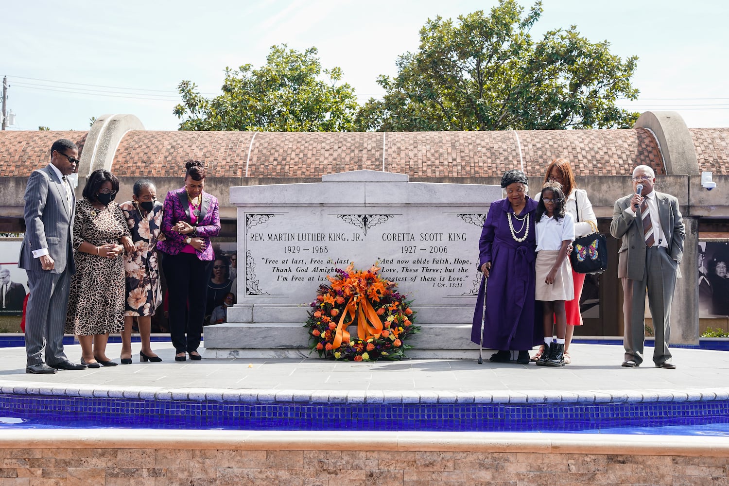 A wreath is seen in front of the tomb of Dr. Martin Luther King Jr. and Coretta Scott King as members of the King family look on at The King Center on the 54th anniversary of the assassination of Dr. Martin Luther King Jr., on Monday, April 4, 2022, in Atlanta. (Elijah Nouvelage/Special to the Atlanta Journal-Constitution)