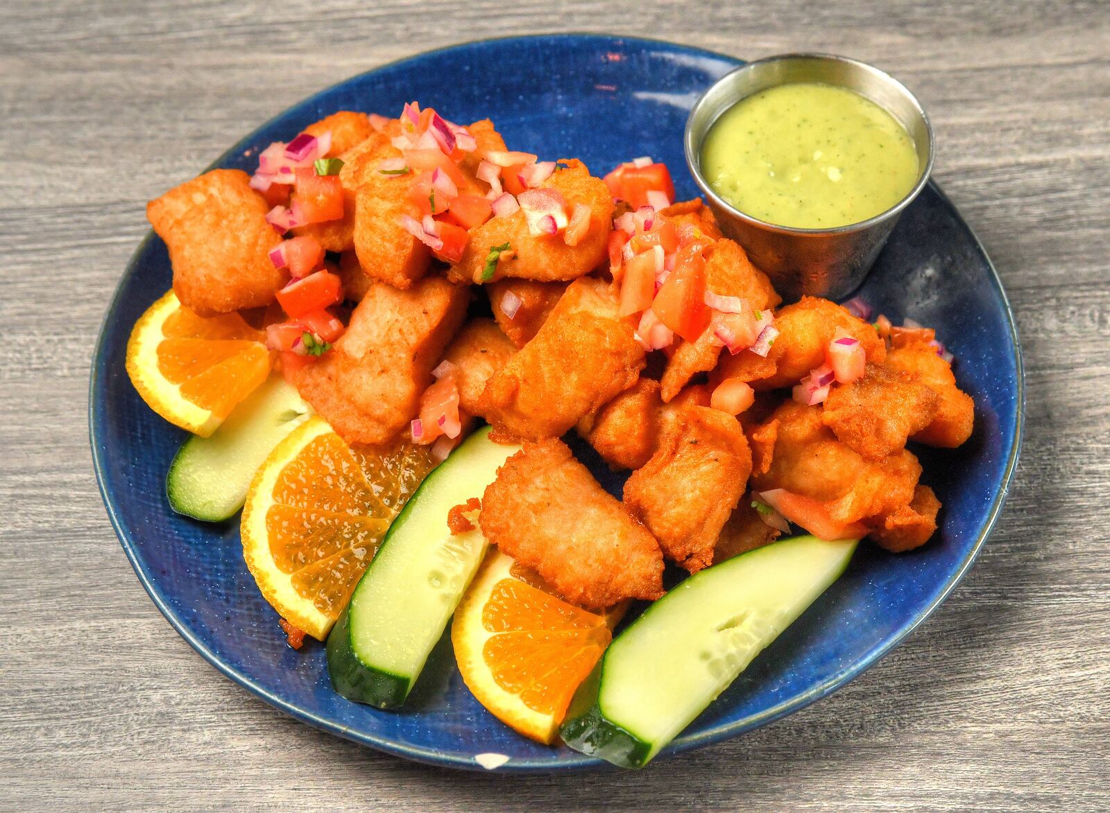 Chicharron De Pescado (pieces of fish marinated and fried to perfection) at El Capitan in Sandy Springs. (Chris Hunt for The Atlanta Journal-Constitution)