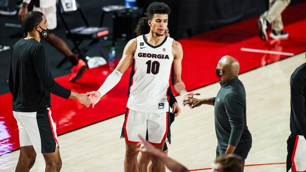 Georgia's Toumani Camara (10) celebrates with his team following 91-78 win over LSU Tuesday, Feb. 23, 2021, at Stegeman Coliseum in Athens. (Tony Walsh/UGA)