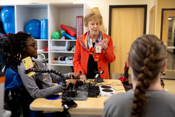 Alana Shepherd (center), founder of Shepherd Center, meets with patient Semajderia “Semmy” Graves (left) at the Shepherd Center in Atlanta on Tuesday, March 12, 2024. (Arvin Temkar / arvin.temkar@ajc.com)