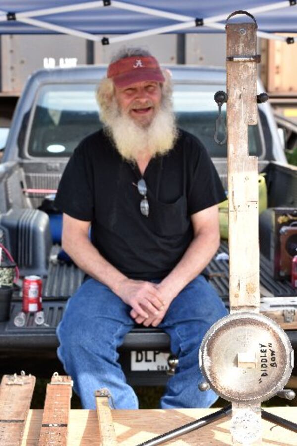 Instrument maker Robert Smith of Fort Payne, Ala. smiles at his booth at Trade Days in Summerville. HYOSUB SHIN / HSHIN@AJC.COM