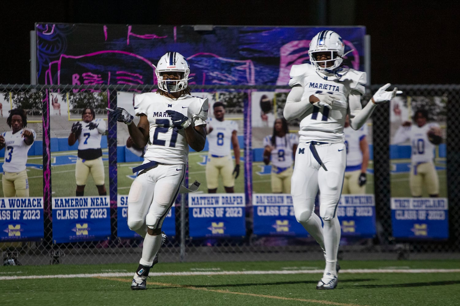 Celebration time: Jace Arnold (left) and Landon Mannery celebrate a touchdown during the Marietta vs. McEachern High School Football game on Friday, October 14, 2022, at McEachern High School in Powder Springs, Georgia. Marietta defeated McEachern 34-16. 