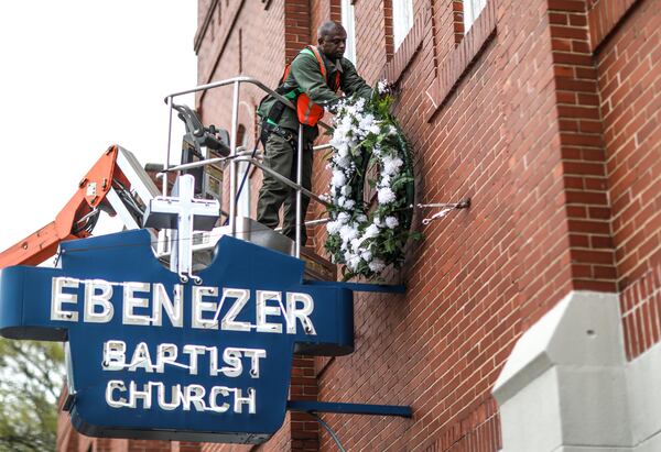 A worker hangs a wreath at Historic Ebenezer Baptist Church on Thursday, April 4, 2019. King was assassinated at the Lorraine Hotel in Memphis 51 years ago today.  BRANDEN CAMP/SPECIAL