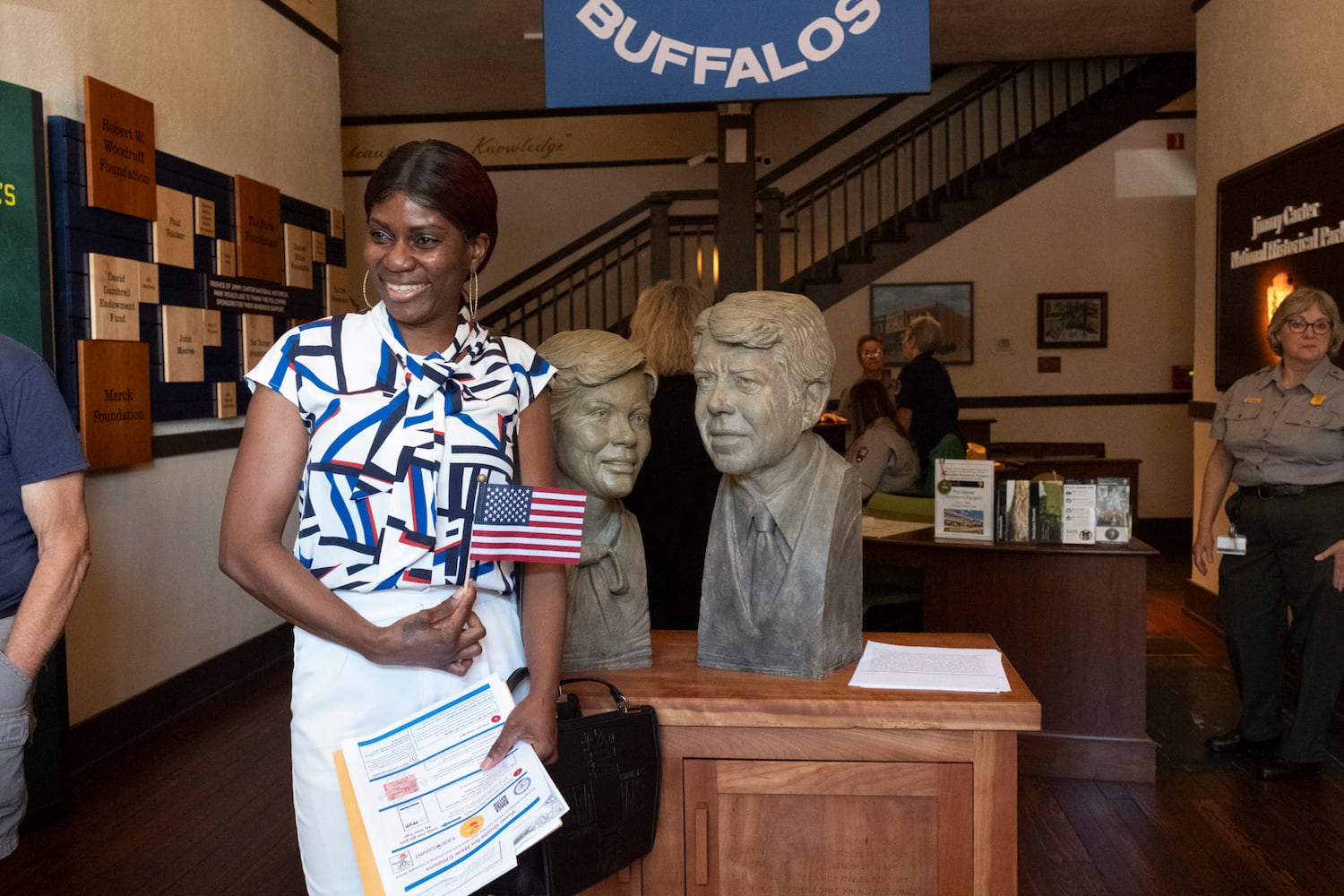 Carlene Ford, from Jamaica, poses for a photo after becoming a U.S. Citizen during a Naturalization ceremony at Jimmy Carter National Historic Park in Plains on Tuesday, Oct. 1, 2024. The ceremony was held in honor of President Carter’s 100th birthday.  Ben Gray for the Atlanta Journal-Constitution