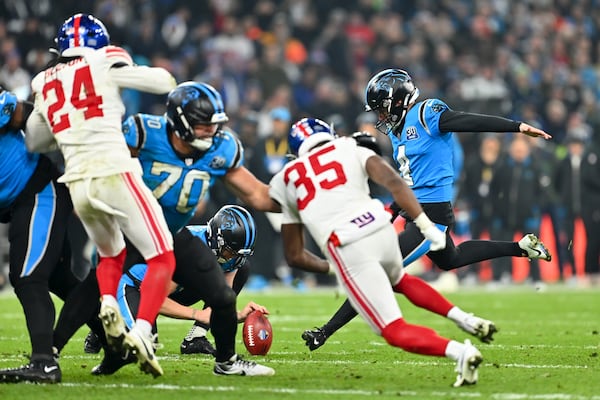 Carolina Panthers kicker Eddy Pineiro kicks the game-winning field goal in overtime against New York Giants during an NFL football game, Sunday, Nov. 10, 2024, in Munich, Germany. (AP Photo/Lennart Preiss)