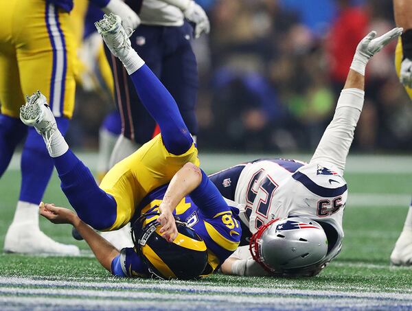 Los Angeles Rams quarterback Jared Goff (16) is leveled on a pass attempt in the fourth quarter, leading to an incomplete pass, against the New England Patriots Sunday, Feb. 3, 2019, during Super Bowl LIII at Mercedes-Benz Stadium in Atlanta.