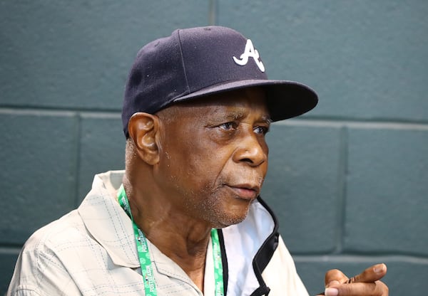 102721 HOUSTON: Former Braves player Ralph Garr, Hank Aaron’s teammate for seven seasons and his friend for more than 50 years, sits in the dugout passing on some of his wisdom before the team plays the Astros in game 2 of the World Series on Wednesday, Oct. 27, 2021, in Houston. Garr was drafted by the Braves in 1967 and made his MLB debut in September 1968. The speedy outfielder split the 1969 and 1970 seasons between Atlanta and the minor leagues, became a big-league regular in 1971 and played for the Braves through 1975. His .353 batting average, 214 hits and 17 triples led the National League in 1974. Hitting leadoff or second in the batting order, he averaged 29 stolen bases a year from 1971 through 1974 -- and could have had more steals if not for the slugger hitting behind him. “I came up (nicknamed) as the ‘Road Runner,’ and the Braves advertised that for a while,” Garr said.     “Curtis Compton / Curtis.Compton@ajc.com”