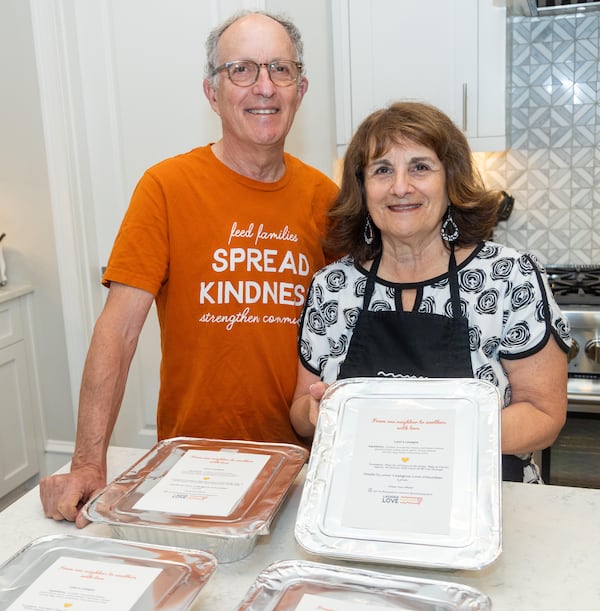 Lynn Hirsch (right) and her husband Dr. Glenn Hirsch, a retired physician, make about four pans of lasagna each week and deliver them to neighbors who signed up to receive a meal from Lasagna Love. PHIL SKINNER FOR THE ATLANTA JOURNAL-CONSTITUTION