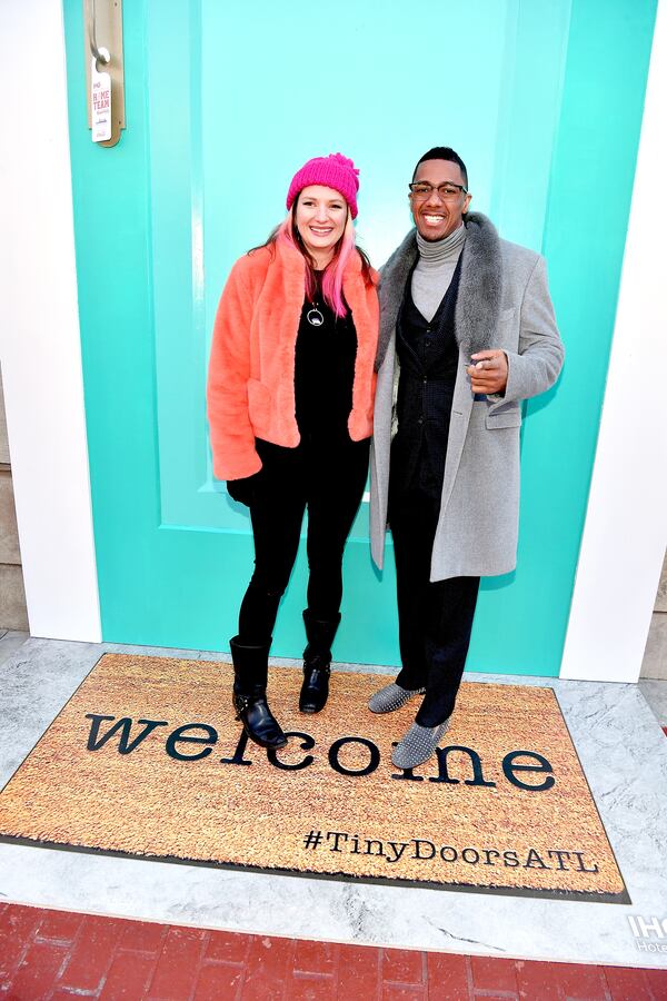 During his impromptu tour in the IHG party bus, Nick Cannon met Atlanta artist, Karen “Tiny Doors ATL” Anderson. Her latest door isn’t tiny, it’s gargantuan. (Photo by Paras Griffin/Getty Images for IHG)