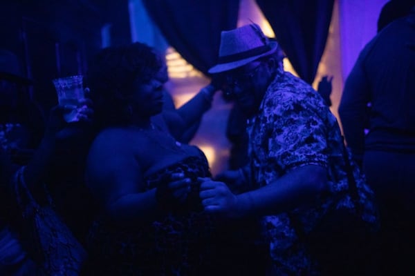 (l. to r.) South Fulton residents Alexis Mathis and SiR Roberts dance with each other at Slow Drag in March 2023.