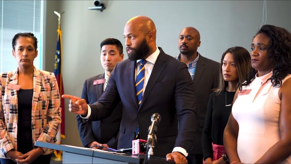 Gwinnett County Commissioner Kirkland Carden speaks against voter challenges during a press conference with fellow Democrats on Oct. 4, 2022. Attendees also include, from left, state Reps. Shelly Hutchinson, Sam Park, Bee Nguyen and Donna McLeod.