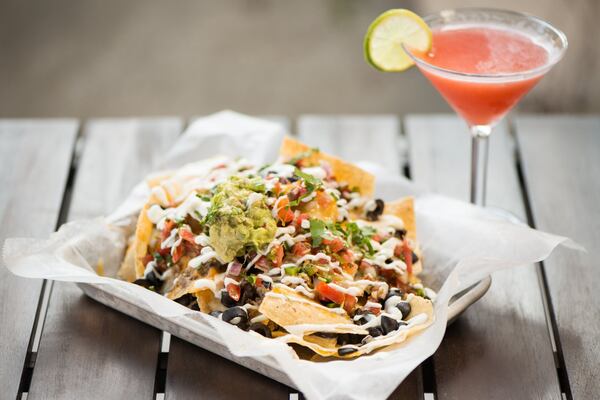  Deep End Nachos with cheddar cheese, queso, black beans, sour cream, pico di gallo, and guacamole. Photo credit- Mia Yakel.