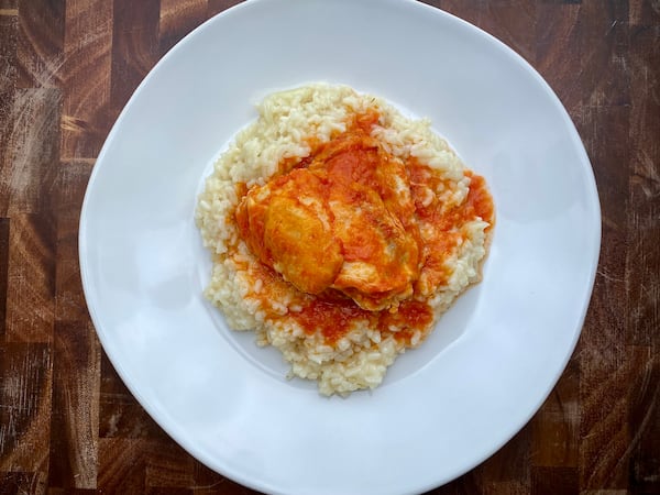 Rice is one of the possible sides for Tomato and Horseradish-Braised Chicken Thighs. (Kellie Hynes for The Atlanta Journal-Constitution)