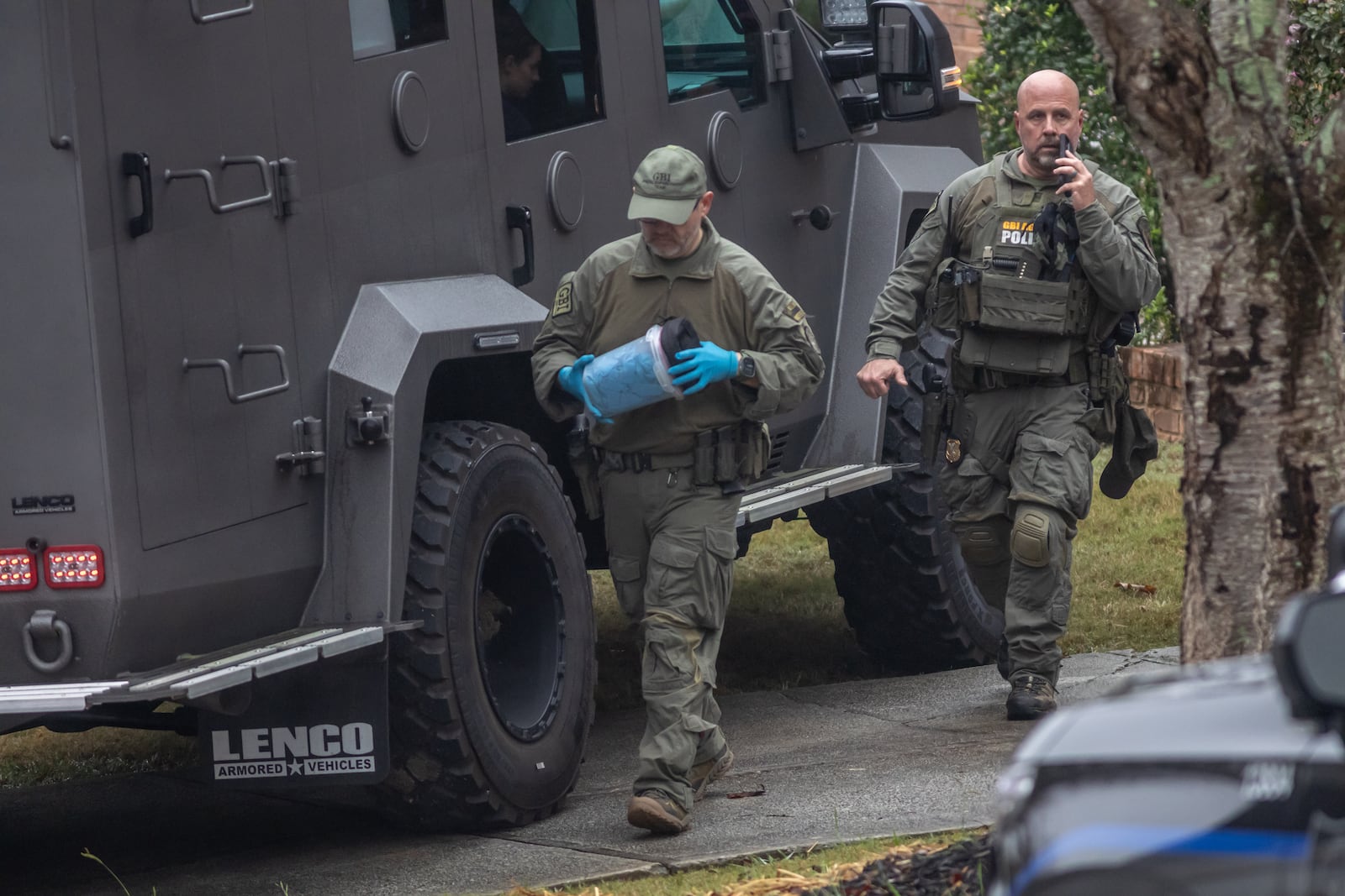 Authorities at a home on Shadow Valley Court near Lithonia, where they arrested a suspect in an October shooting in northeast Georgia.