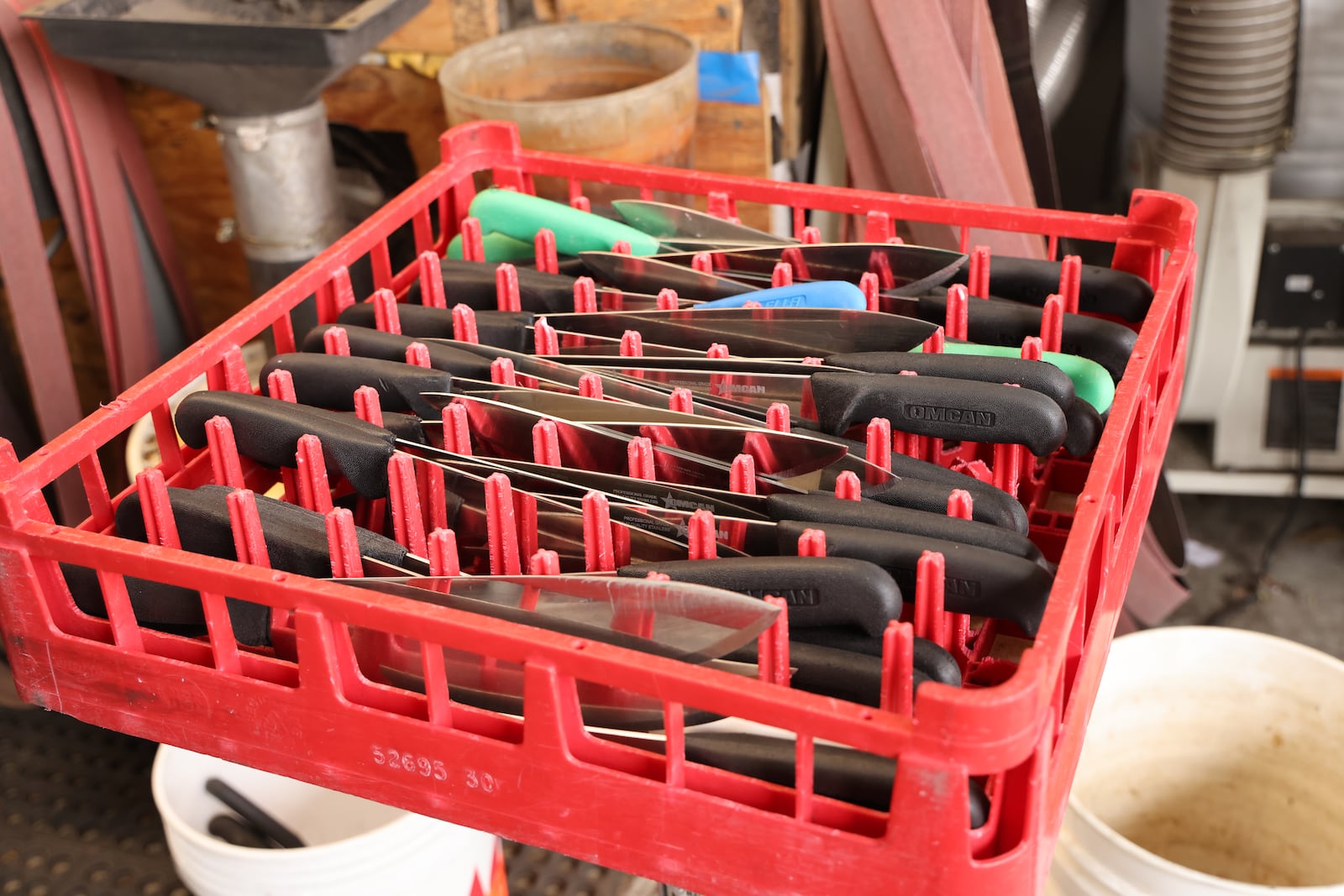 A tray of newly cleaned knives awaits sharpening at the Blade-Smith. Tyson Horne/tyson.horne@ajc.com
