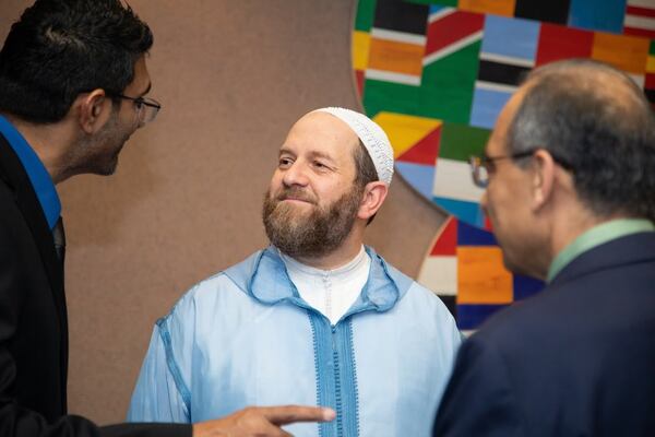 Shaykh Muhammad al-Ninowy talks with guests attending the launch of his “The Book of Love” in 2020 at the Carter Center. (AJC file photo / SARA ABUGIDEIRI / WESTERLY PHOTOGRAPHY