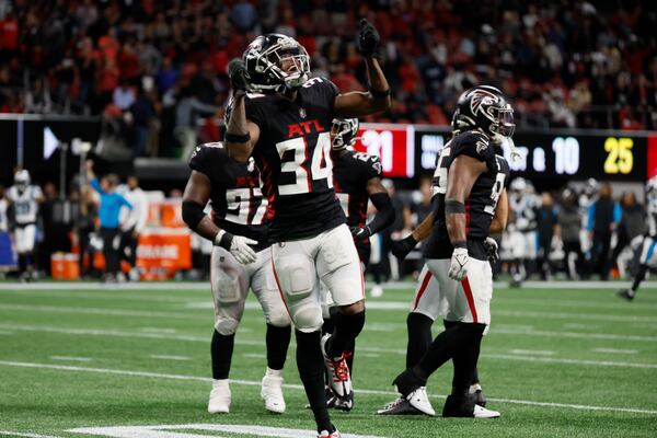 Falcons cornerback Darren Hall (34) reacts at the end of the regular time when the game ended in a tie. The falcons defeated the Carolina Panthers 37-34 in overtime.
 Miguel Martinez / miguel.martinezjimenez@ajc.com