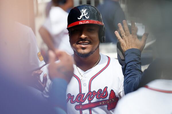 Atlanta Braves catcher Chadwick Tromp (45) high-fives teammates at the dugout after scoring his team’s third run during the fifth inning against the New York Mets at Truist Park on Thursday, April 11, 2024.
Miguel Martinez / miguel.martinezjimenez@ajc.com 