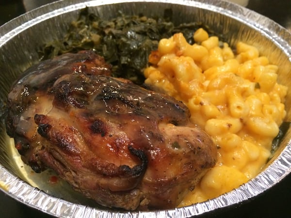 The “Slow Smoked” chicken at Annie Mae’s Pantry rests in a classic broth of thyme, garlic and onions and comes with two sides — such as macaroni and cheese and collards. CONTRIBUTED BY WENDELL BROCK