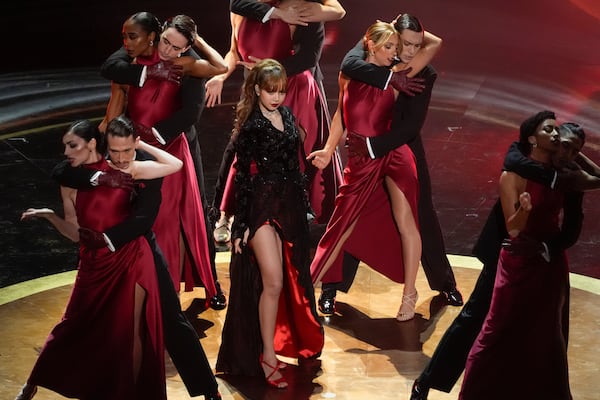 Lisa, center, sings "Live and Let Die" during the Oscars on Sunday, March 2, 2025, at the Dolby Theatre in Los Angeles. (AP Photo/Chris Pizzello)