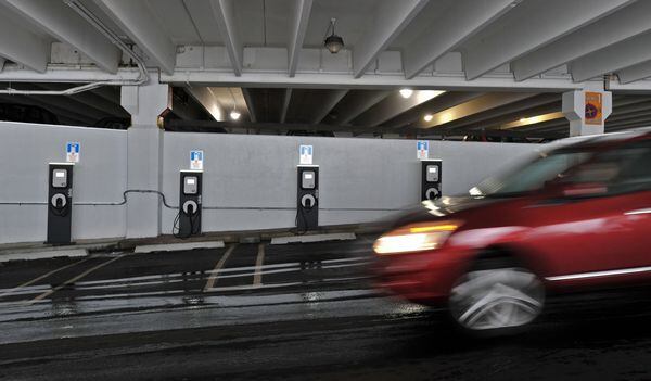 Shopping malls such as Lenox Square are among the businesses and public places that have already installed electric vehicle charging stations so “EV” owners can juice their vehicles when away from home, part of a push to ease pollution and reduce gasoline demand.