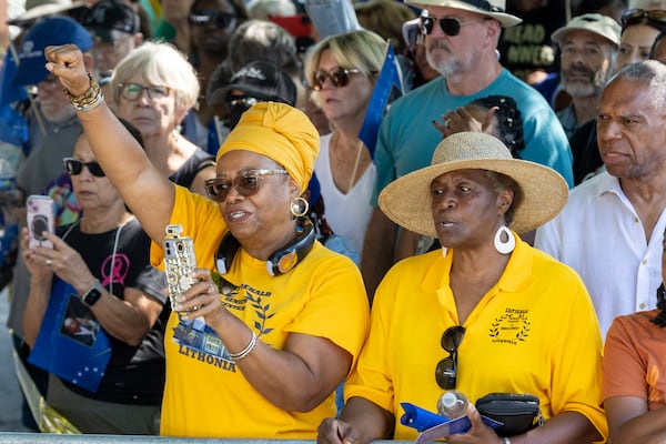 The crowd sings along to the song Lift Every Voice during the statue unveiling ceremony honoring the late Congressman John Lewis in Decatur on Saturday, Aug 24, 2024. (Steve Schaefer / AJC)