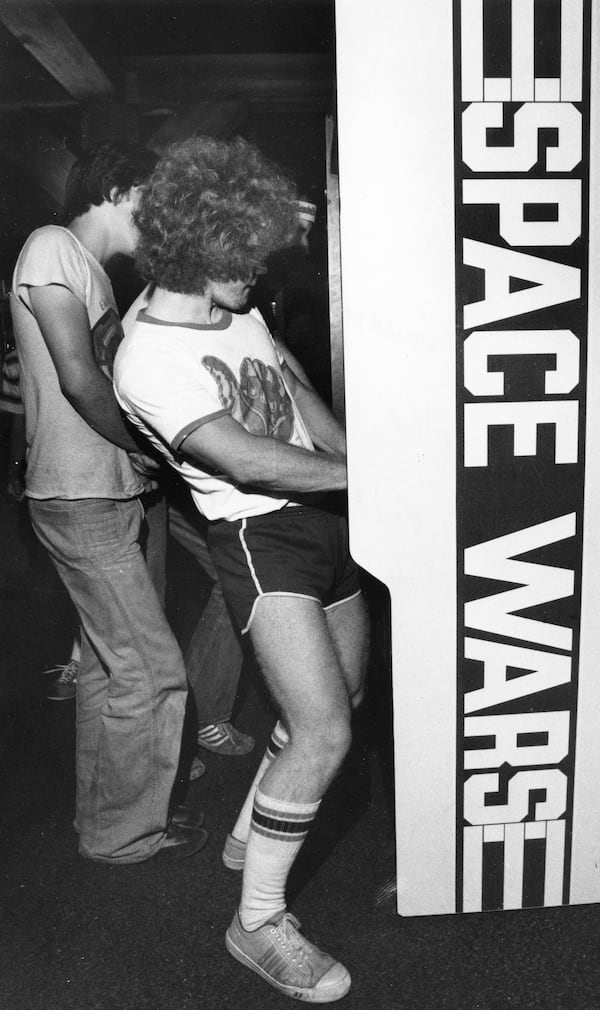 Teenagers playing video games at Cumberland Mall, in Cobb County, on June 23, 1978.