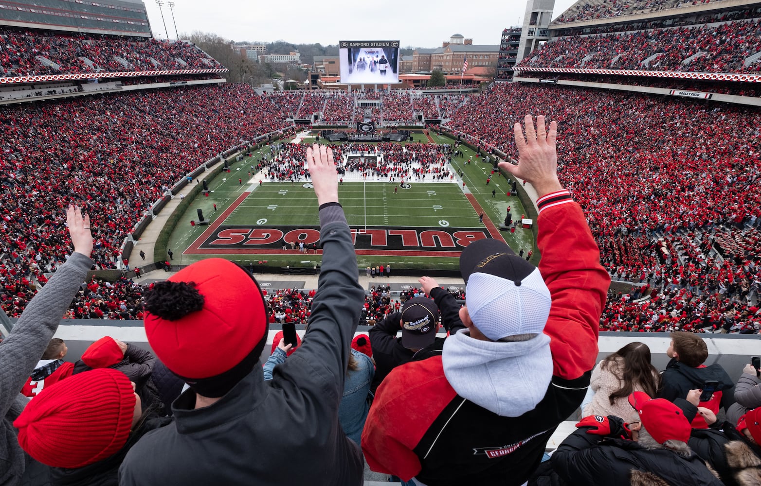 Fans cheer as UGA players enter the stadium for the National Championship celebration Saturday afternoon, Jan. 15, 2022, in Athens. Ben Gray for the Atlanta Journal-Constitution