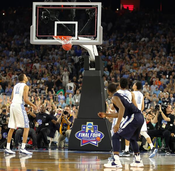 Villanova's Kris Jenkins (2) watches his game winning three point basket at the closing seconds of the NCAA Final Four tournament college basketball championship game against North Carolina, Monday, April 4, 2016, in Houston. Villanova won 77-74. (AP Photo/Kiichiro Sato)