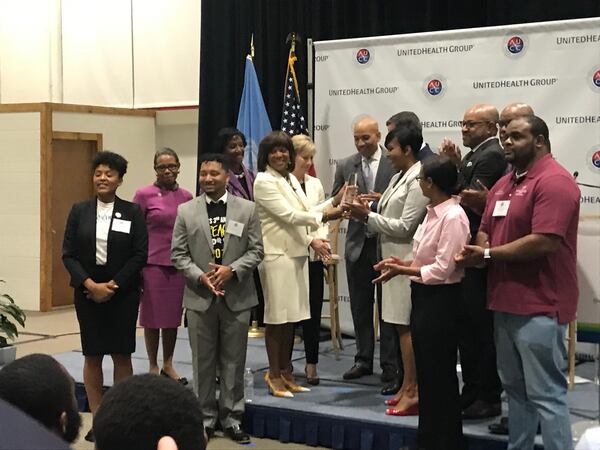 Morehouse School of Medicine President Dr. Valerie Montgomery Rice presents a gift to Atlanta Mayor Keisha Lance Bottoms during an event on July 2, 2019, announcing UnitedHealth Group is investing $8.25 million over five years into data science education at the Atlanta University Center. 