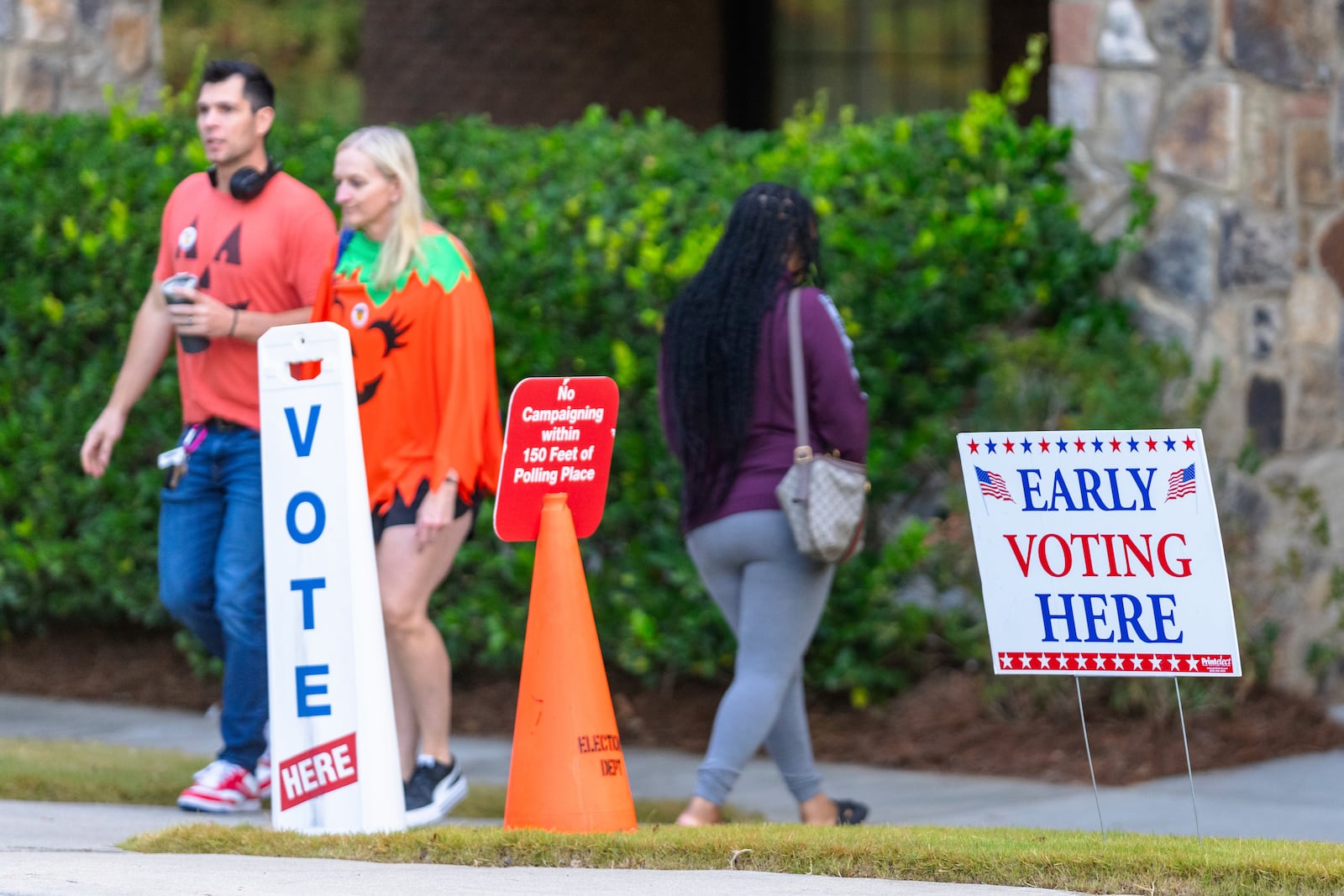 FILE - An Early Voting sign and a "No Campaigning within 150 feet of Polling Place" sign seen the polling station, Oct. 31, 2024, in Stockbridge, Ga. (AP Photo/Jason Allen, File)