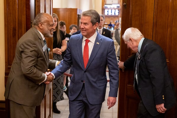 Gov. Brian Kemp enters the House of Representatives on Thursday to speak to its members on Sine Die, the last day of the legislative session. (Arvin Temkar / arvin.temkar@ajc.com)