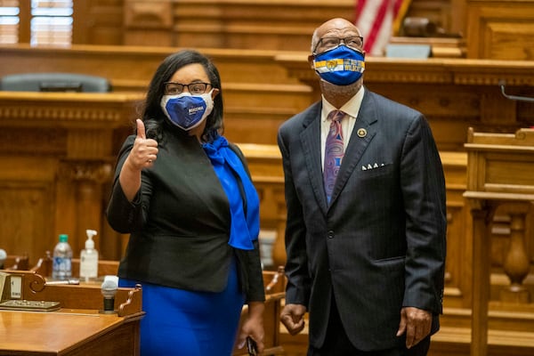 Democratic electors Nikema Williams and Calvin Smyre talk before casting their electoral votes for Joe Biden on Dec. 14, 2020, in the Georgia Senate. Williams, chair of the state party, said the vote helped “restore the soul of our nation.” (Alyssa Pointer / Alyssa.Pointer@ajc.com)