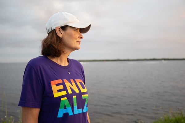 Michele Hall, 55, of Bradenton, looks at her walking companions at the De Soto National Memorial on Sunday, Sept. 25, 2022, in Bradenton, Florida. Michele was diagnosed with Alzheimer's disease when she was 53. "I cant read or write or any of that stuff. But I can talk." (Angelica Edwards/Tampa Bay Times/TNS)