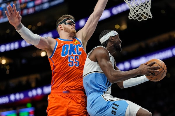 Atlanta Hawks guard Caris LeVert (3) shoots against Oklahoma City Thunder center Isaiah Hartenstein (55) during the first half of an NBA basketball game, Friday, Feb. 28, 2025, in Atlanta. (AP Photo/Mike Stewart)