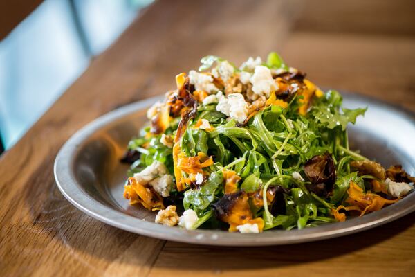 Ammazza Decatur Insalata di Arugula with baby arugula, butternut squash, toasted walnuts, gorgonzola, and thyme vinaigrette. Photo credit- Mia Yakel.