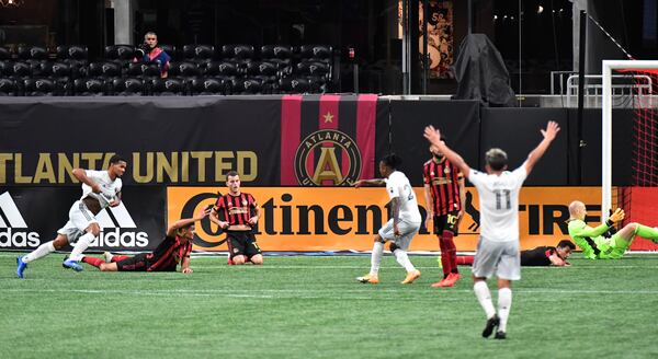 D.C. United forward Gelmin Rivas (left) celebrates after scoring a goal during the second half against Atlanta United Saturday, Oct. 24, 2020, at Mercedes-Benz Stadium in Atlanta. D.C. United won 2-1. (Hyosub Shin / Hyosub.Shin@ajc.com)