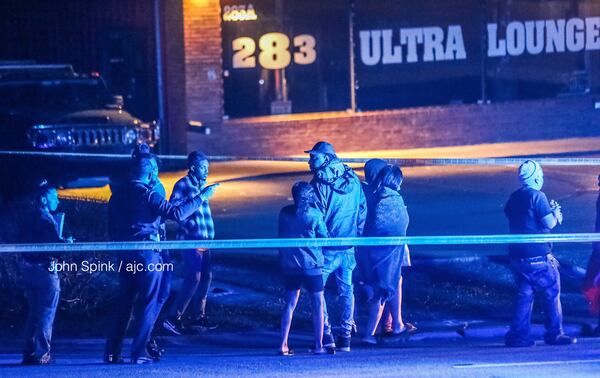 Police blocked off the parking lot to the 283 Ultra Lounge in Riverdale while they investigated an overnight shooting. JOHN SPINK / JSPINK@AJC.COM