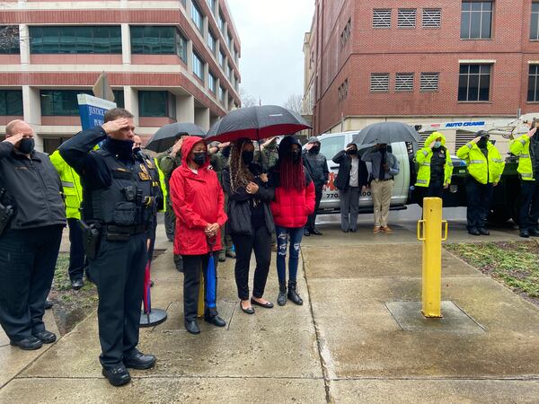 Officers pay their respects to Smyrna police Officer Christopher Ewing, who was killed last year in the line of duty.