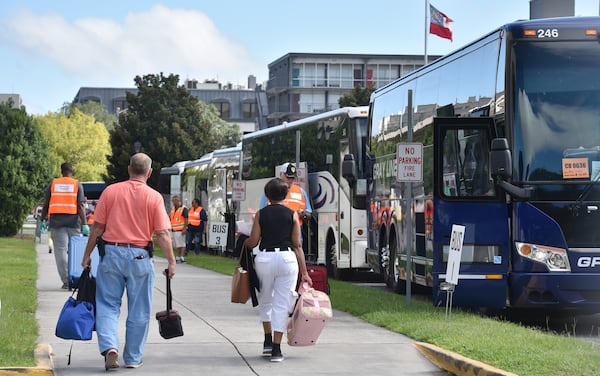 Hundreds of local residents get on buses outside the Savannah Civic Center for a free transportation to an inland shelter under mandatory evacuation ahead of Hurricane Dorian on Tuesday, September 3, 2019. Chatham Area Transit (CAT) provided free transportation to residents without private transportation to the Savannah Civic Center to assist in the mandatory evacuation of Chatham County.