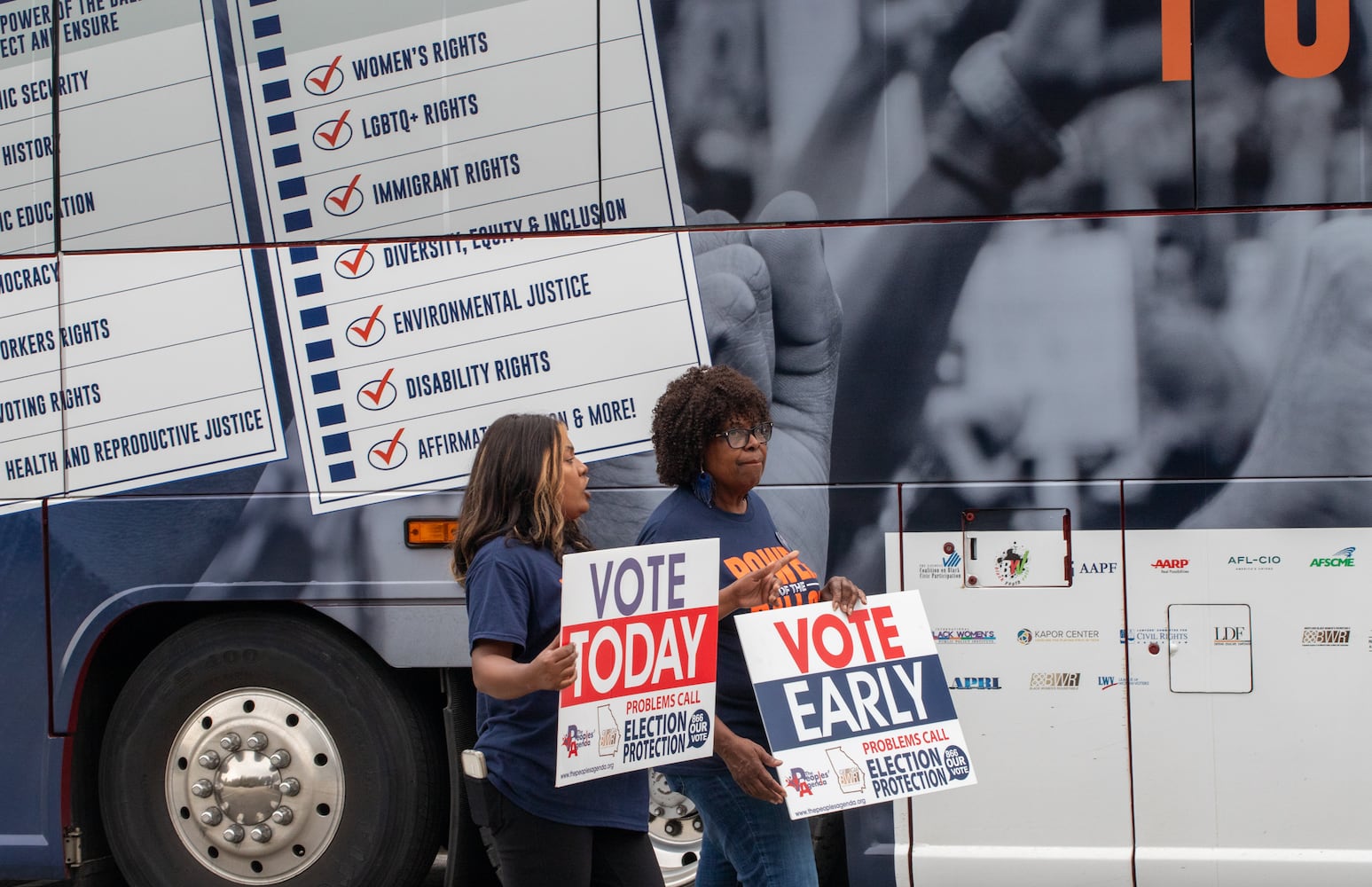 The last day of early voting in Georgia takes place on Friday, November 1, 2024 at C.T. Martin Natatorium and Recreation Center in South Fulton County where several non-profit, non-partisan groups, including Devi McDonald, let, Damaris Dmc, gathered nearby to encourage people to vote, giving out free snacks, t-shirts and food.  The polling location had a steady stream of voters throughout the day.  (Jenni Girtman for The Atlanta Journal-Constitution)