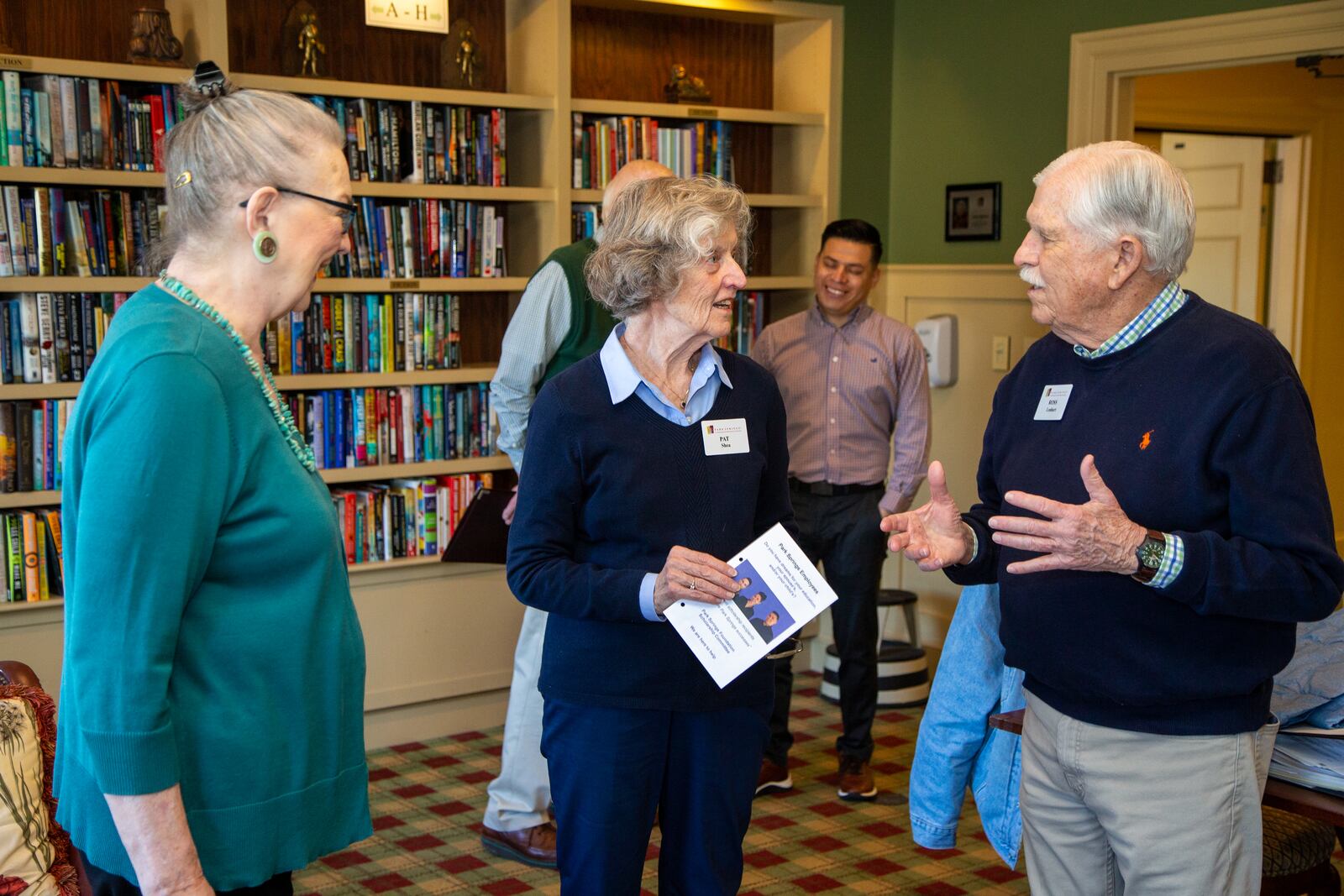 Barbara Cooper (from left), Pat Shea and Ross Lenhart talk in the Park Springs library.  PHIL SKINNER FOR THE ATLANTA JOURNAL-CONSTITUTION.