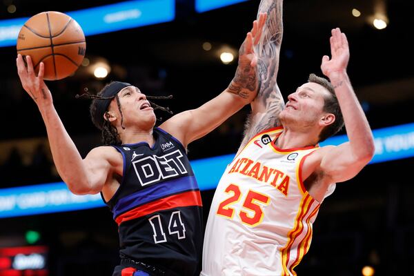 Detroit Pistons guard R.J. Hampton, left, shoots against Atlanta Hawks guard Garrison Mathews, right, during the second half of an NBA basketball game Tuesday, March 21, 2023, in Atlanta. (AP Photo/Alex Slitz)