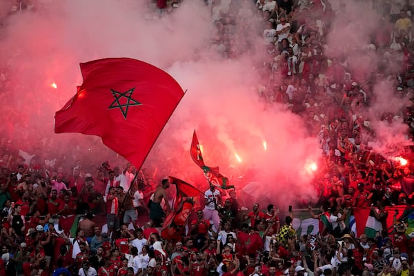 FILE - Morroco fans light flares during a men's semifinal soccer match between Morocco and Spain at the 2024 Summer Olympics, Monday, Aug. 5, 2024, at Marseille Stadium in Marseille, France. (AP Photo/Daniel Cole, File)