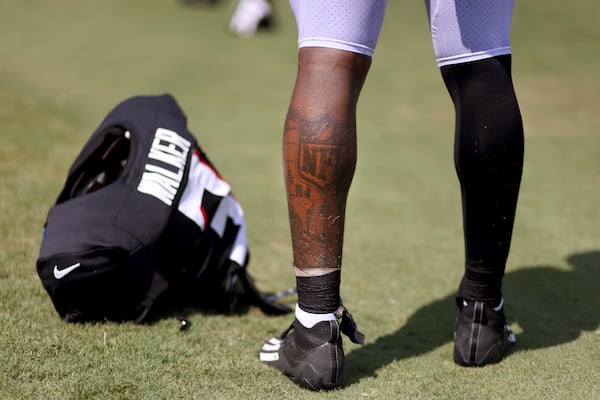 Atlanta Falcons inside linebacker Mykal Walker has several tattoos on his left leg that speak on his football career. The most prominent tattoo on his leg is the NFL logo on his left calf, which recognizes him being drafted by the Atlanta Falcons in 2020, round four, pick 13. (Jason Getz / Jason.Getz@ajc.com)