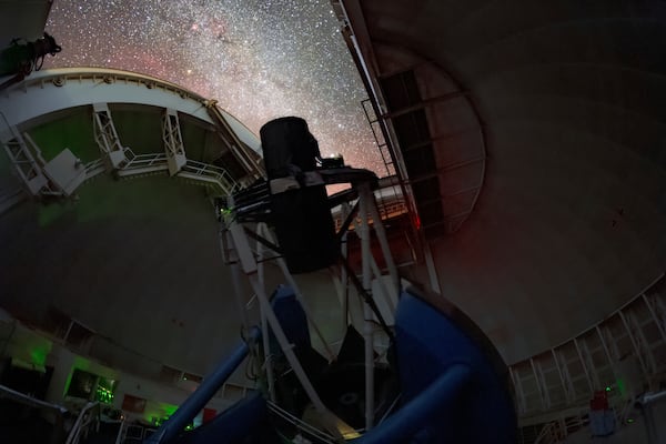 The Dark Energy Spectroscopic Instrument (DESI) making observations in the night sky on the Nicholas U. Mayall 4-meter Telescope at Kitt Peak National Observatory in Tucson, Ariz. (Peter Toman Tomas Slovinsky/NSF's NOIRLab via AP)