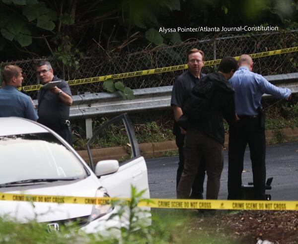 Police investigate a shooting at a gas station in the Smoke Rise community of Stone Mountain.