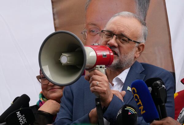 Expelled South Africa Ambassador Ebrahim Rasool speaks to supporters following his arriving, at Cape Town International Airport in Cape Town, South Africa, Sunday, March 23, 2025. (AP Photo/Nardus Engelbrecht)