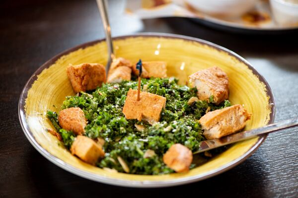 Kale Crunch salad with vegan chicken, toasted almonds, currants, and lemon zest dressing. Photo credit- Mia Yakel.