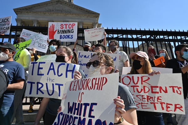 Educators rally outside the Georgia Capitol earlier this year in opposition to legislation that would limit what teachers may teach in the classroom. (Hyosub Shin / Hyosub.Shin@ajc.com)